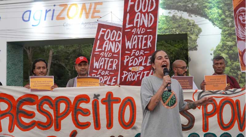 Climate activists at COP30 confront industry lobbyists at AgriZone, kicking off 1st week of negotiations